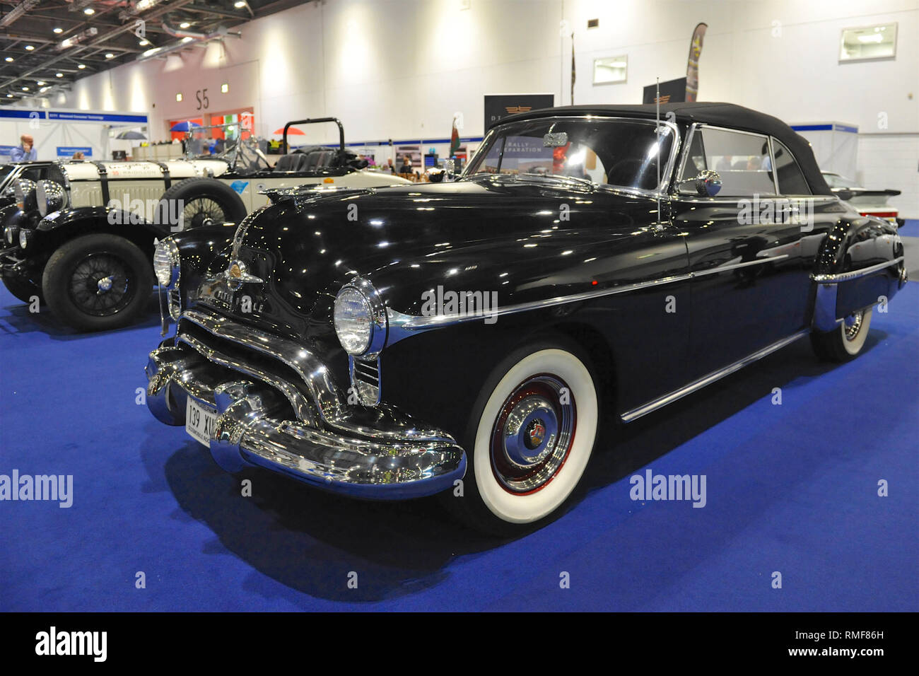 ExCel London, UK. 14th Feb 2019. London, UK. 14th Feb, 2019. A 1950 Oldsmobile 'Rocket' 88 Convertible on display at the London Classic Car Show which is taking place at ExCel London, United Kingdom.  Around 700 of the world's finest classic cars are on display at the show ranging from vintage pre-war tourers to a modern concept cars. The show brings in around 37,000 visitors, ranging from serious petrol heads to people who just love beautiful and classic vehicles. Credit: Michael Preston/Alamy Live News Stock Photo