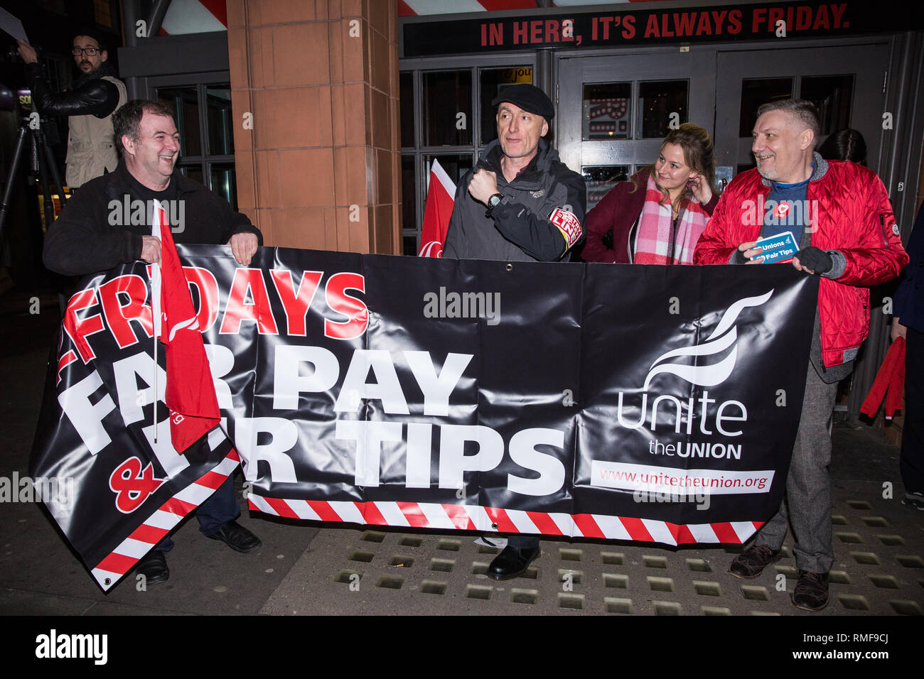 London, UK. 14th February, 2019. Members and supporters of the Restaurant, Catering and Bar Workers Branch of Unite the Union mark the first anniversary of a strike - since ended - for fair tips and fair pay by TGI Fridays workers outside a branch of the chain in Covent Garden. Unite plan to call on HMRC next week to conduct two investigations into the conduct of TGI Fridays, one regarding their Tronc scheme for tips and the other regarding minimum wage issues. Credit: Mark Kerrison/Alamy Live News Stock Photo