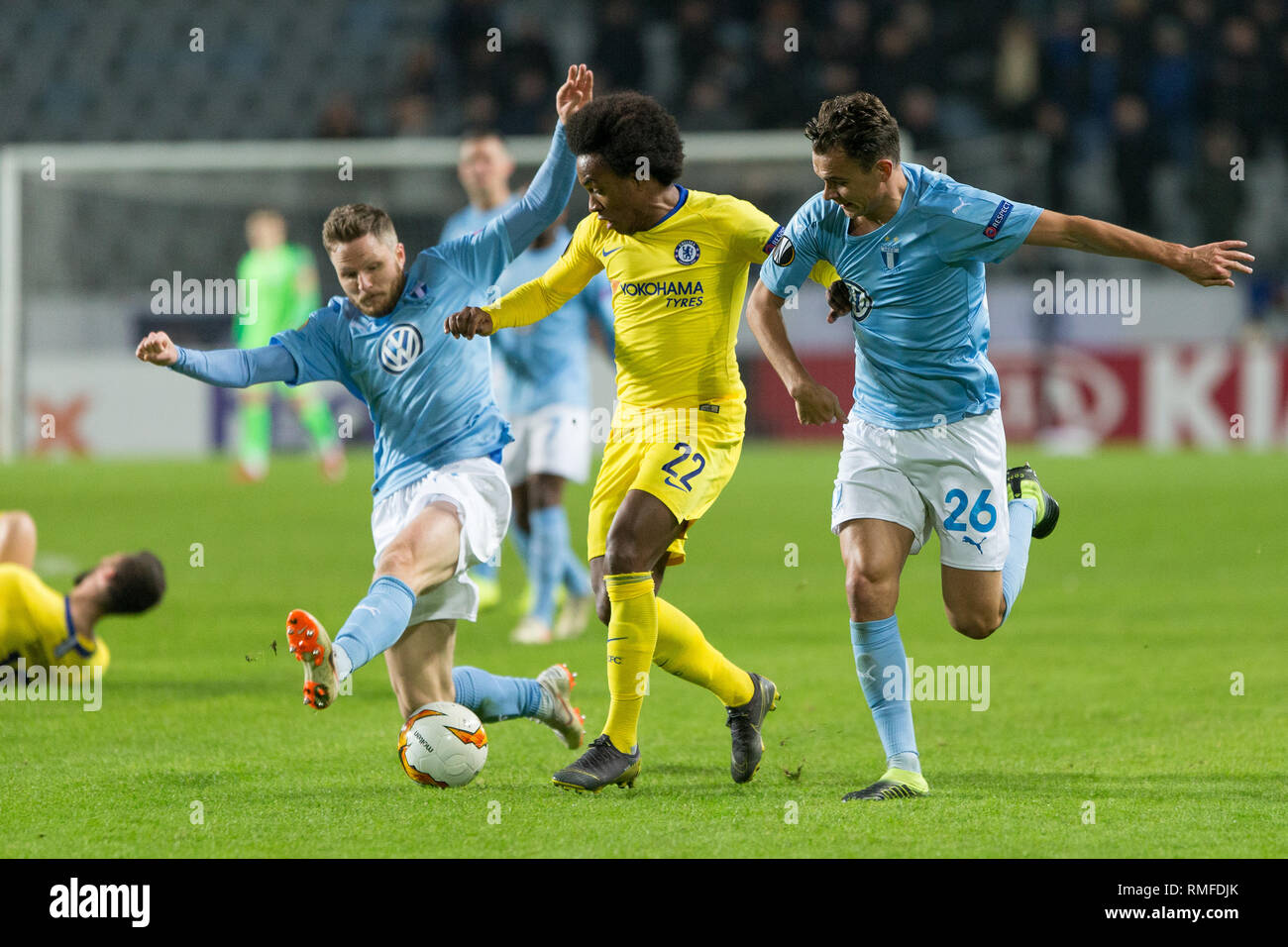 Malmo, Sweden. 14th Feb, 2019. Sweden, Malmö, February 24 2019. Lasse Nielsen of Malmö FF tackles Willian (22) during the Europa League round of 32 match between Malmö FF and Chelsea FC at Swedbank Stadion in Malmö. (Photo Credit: Gonzales Photo/Alamy Live News Stock Photo
