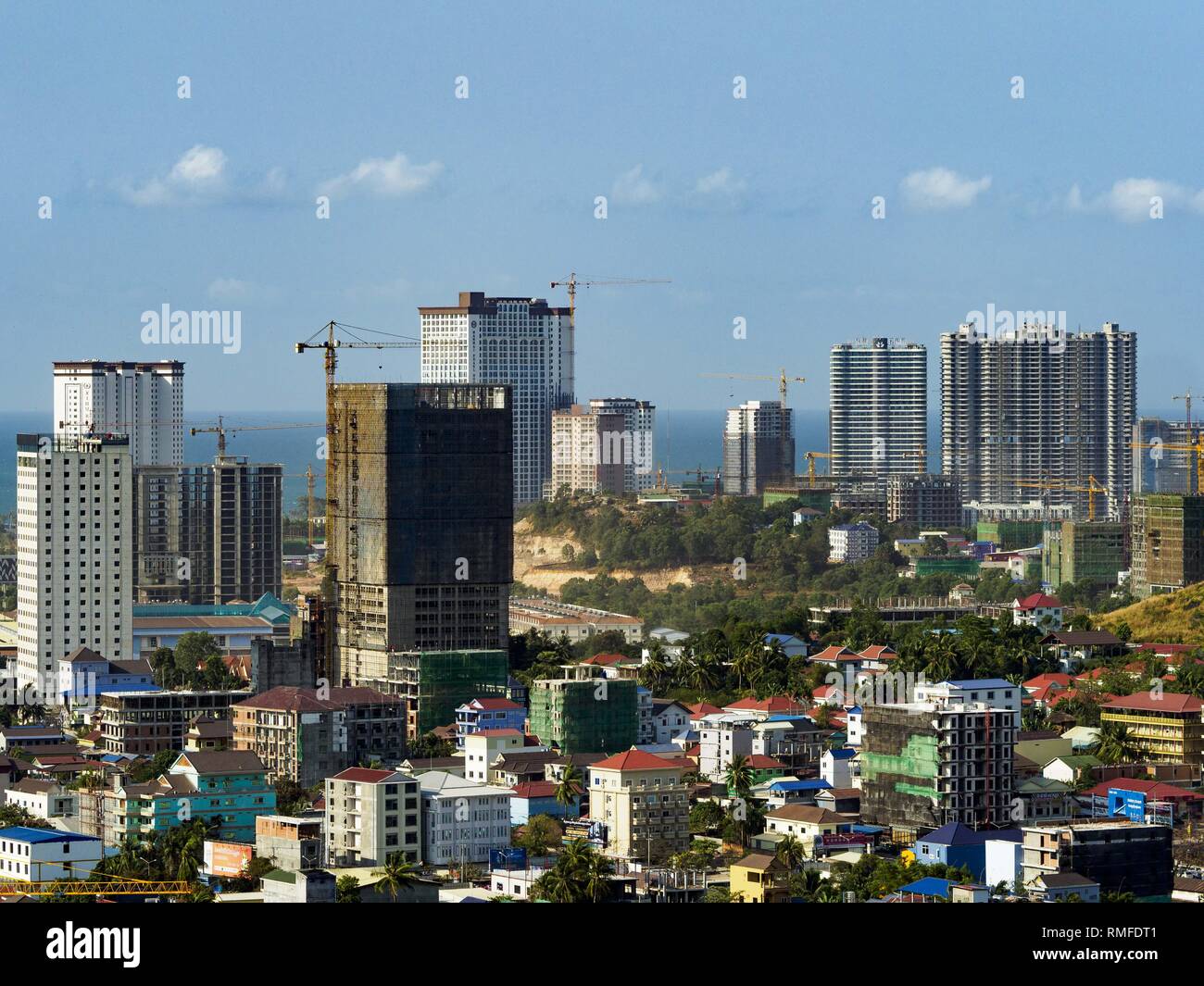 Sihanoukville, Preah Sihanouk, Cambodia. 15th Feb, 2019. Construction sites for Chinese resorts and casinos rise over downtown Sihanoukville. There are about 80 Chinese casinos and resort hotels open in Sihanoukville and dozens more under construction. The casinos are changing the city, once a sleepy port on Southeast Asia's ''backpacker trail'' into a booming city. The change is coming with a cost though. Many Cambodian residents of Sihanoukville have lost their homes to make way for the casinos and the jobs are going to Chinese workers, brought in to build casinos and work in the casin Stock Photo