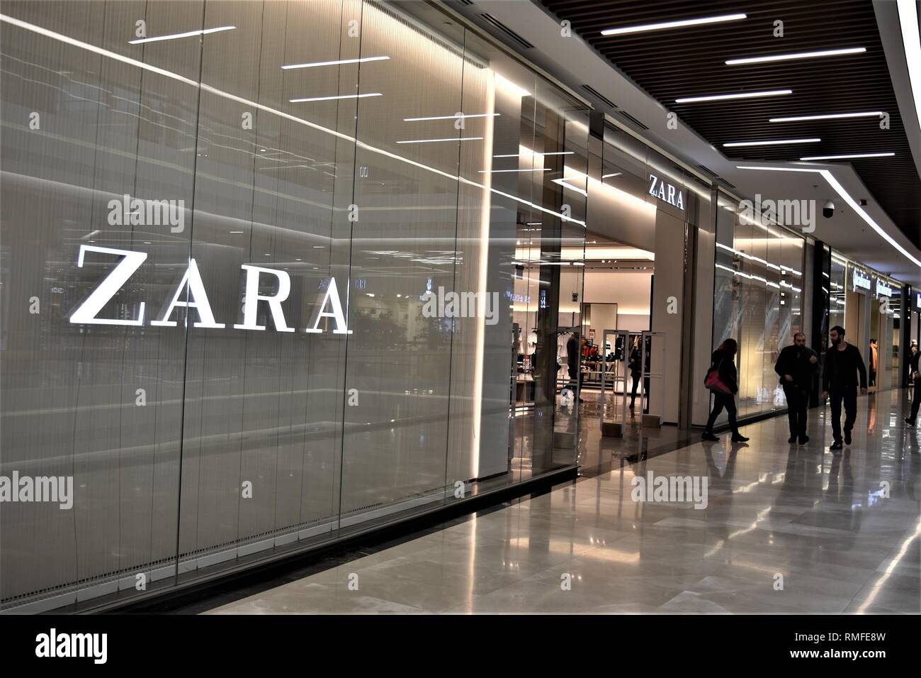 Ankara, Turkey. 14th Feb, 2019. Shoppers walk past a Zara clothing store in  a shopping mall. Zara is the main brand of the Inditex group, one of the  world's largest apparel retailer.