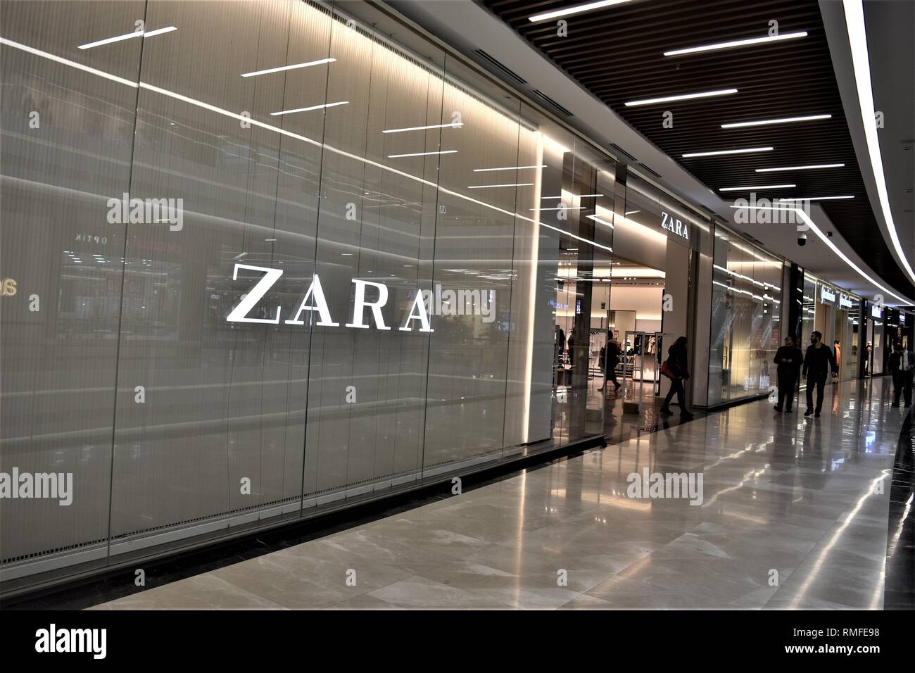 Ankara, Turkey. 14th Feb, 2019. Shoppers walk past a Zara clothing store in  a shopping mall. Zara is the main brand of the Inditex group, one of the  world's largest apparel retailer.