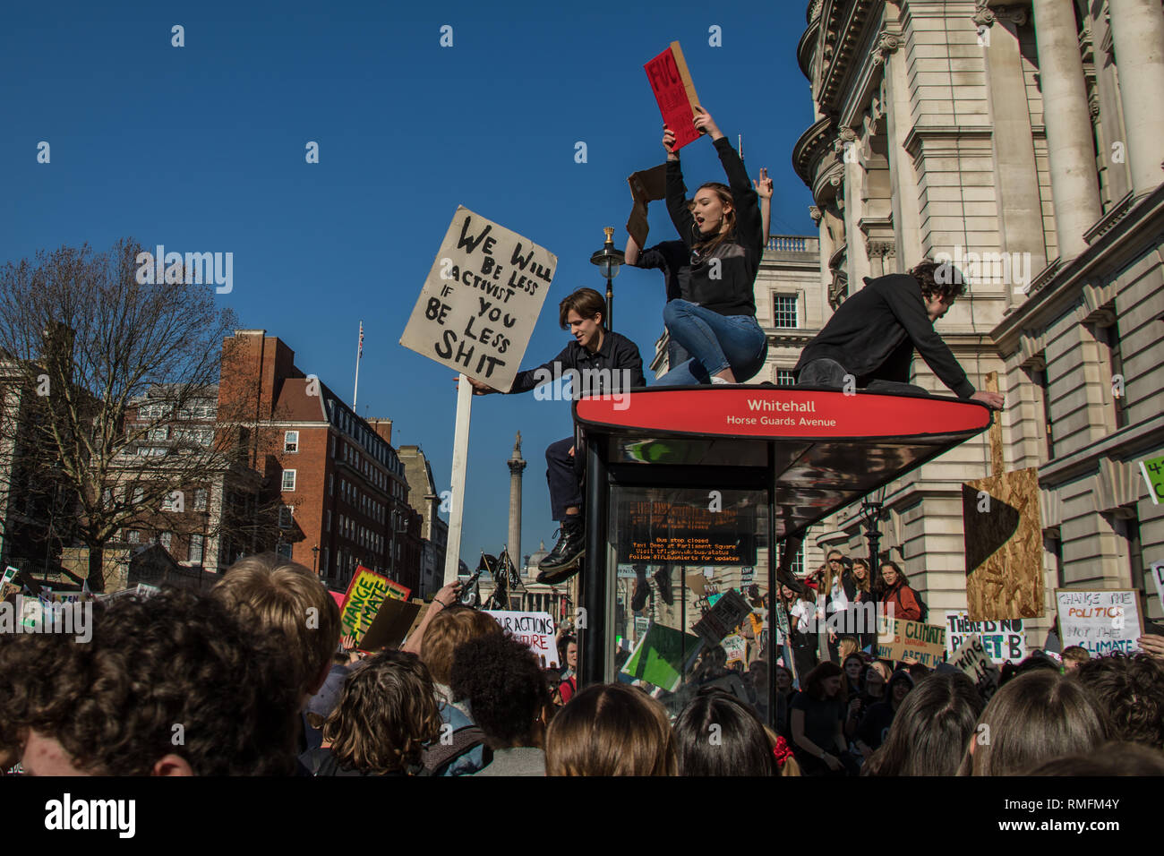 London, UK. 15 February, 2019. On top of a bus stop on Whitehall. Children took a day off school to join the climate rebellion, the young protesters rallied in Parliament Square to demand urgent government action. David Rowe/ Alamy Live News. Stock Photo