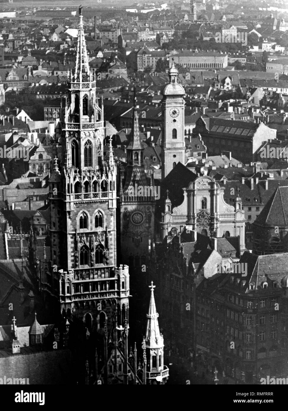View from the Frauenkirche (Cathedral of Our Blessed Lady) from left to right at the Neue Rathaus (New Town Hall) and Alte Rathaus (Old Town Hall) and the Heilig-Geist-Kirche in Munich. Stock Photo