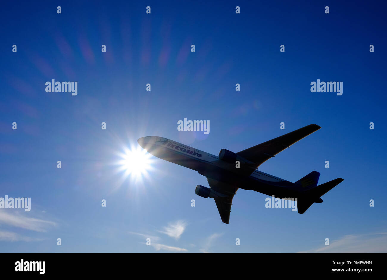 jet airliner commercial aircraft in flight on blue sky background Stock Photo