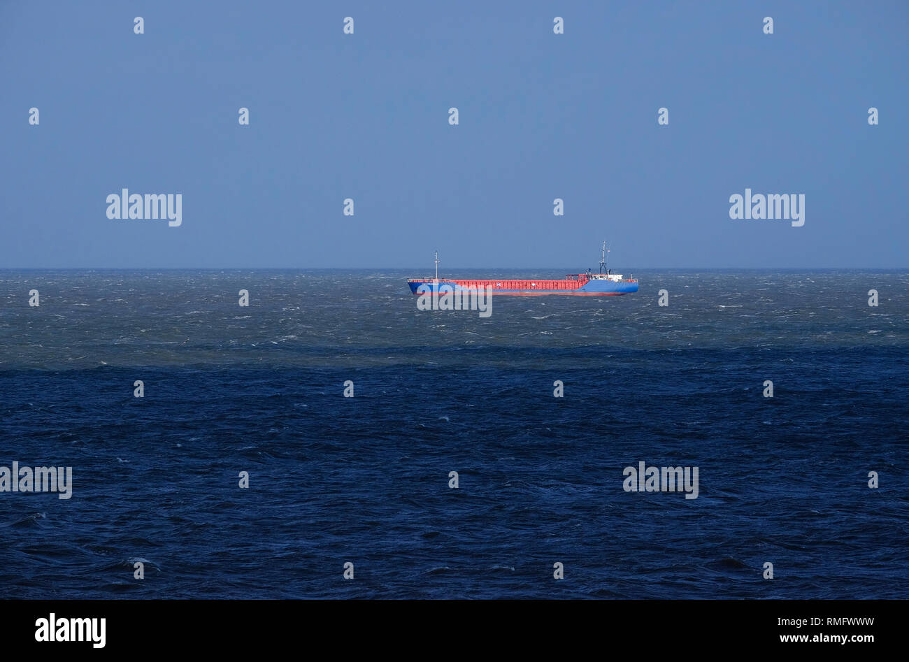 freighter cargo ship in north sea seascape Stock Photo