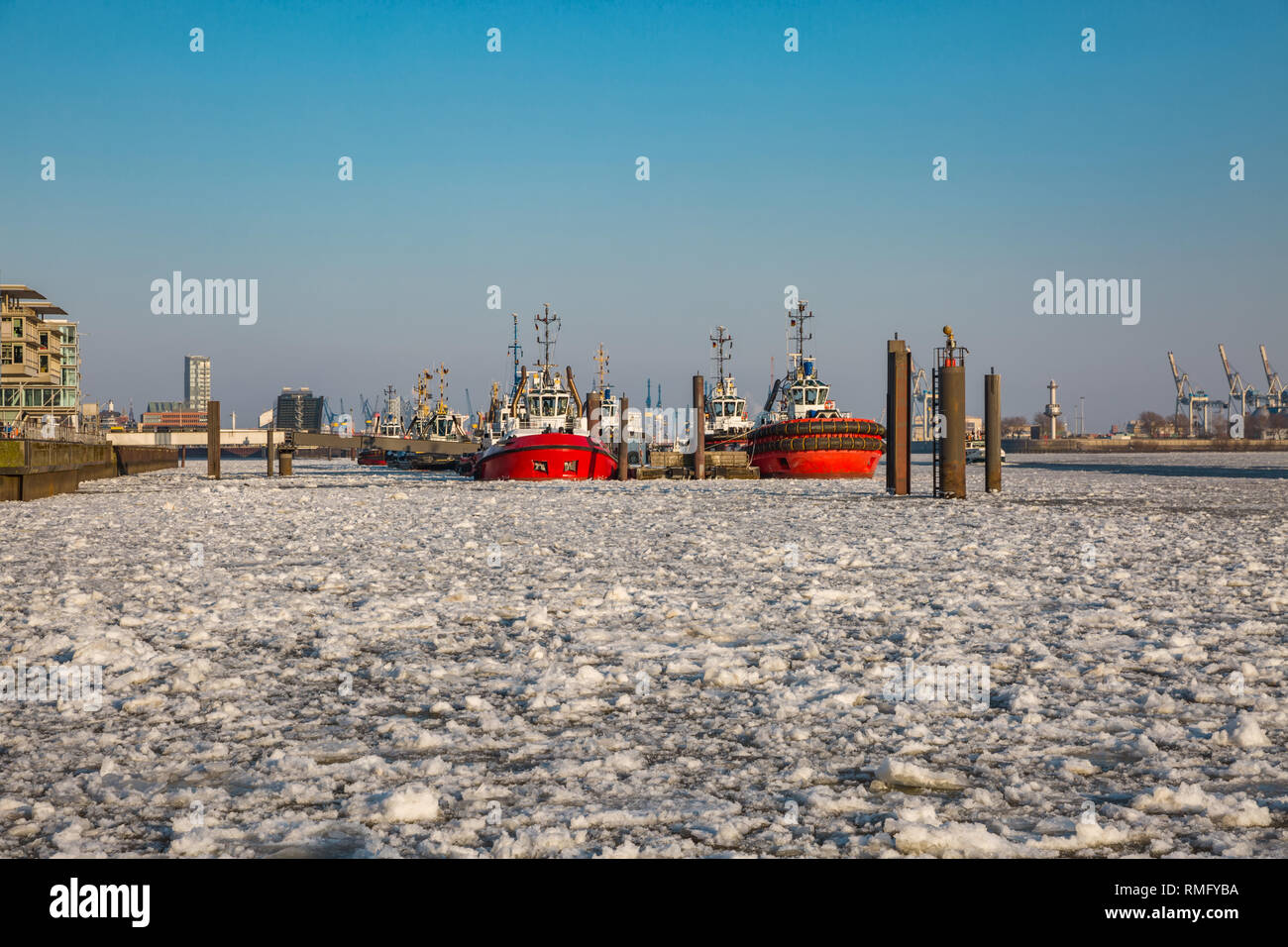 Tug feeder in winter with frozen water surface Stock Photo