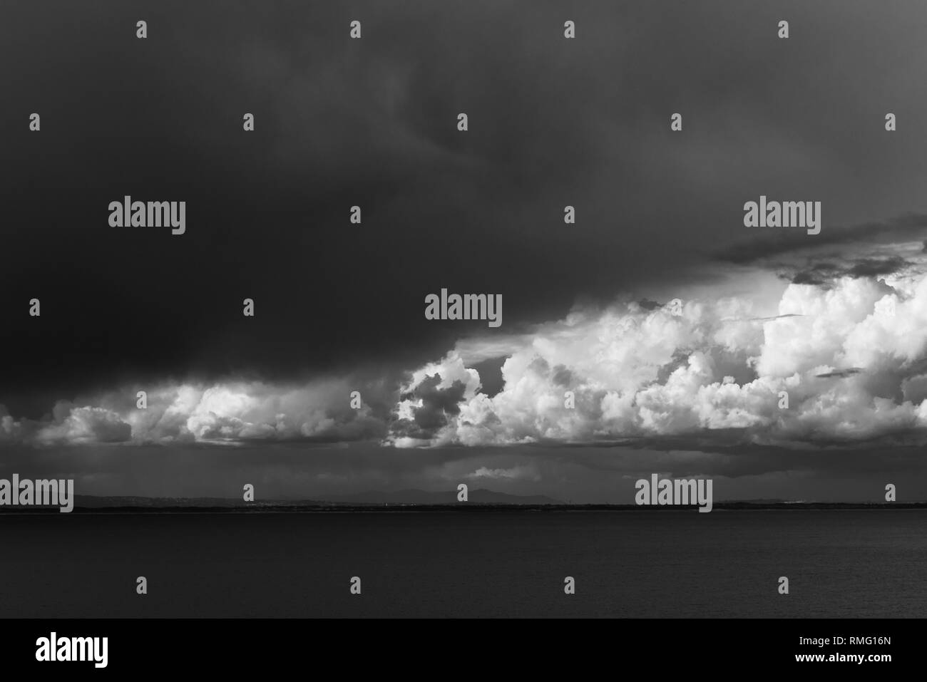 Black and white image of storm clouds of the ocean Stock Photo - Alamy
