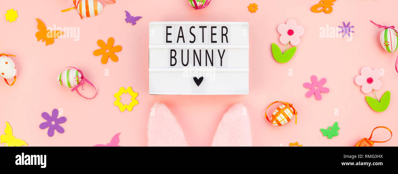 Creative Top view flat lay holiday composition Easter bunny text on ...