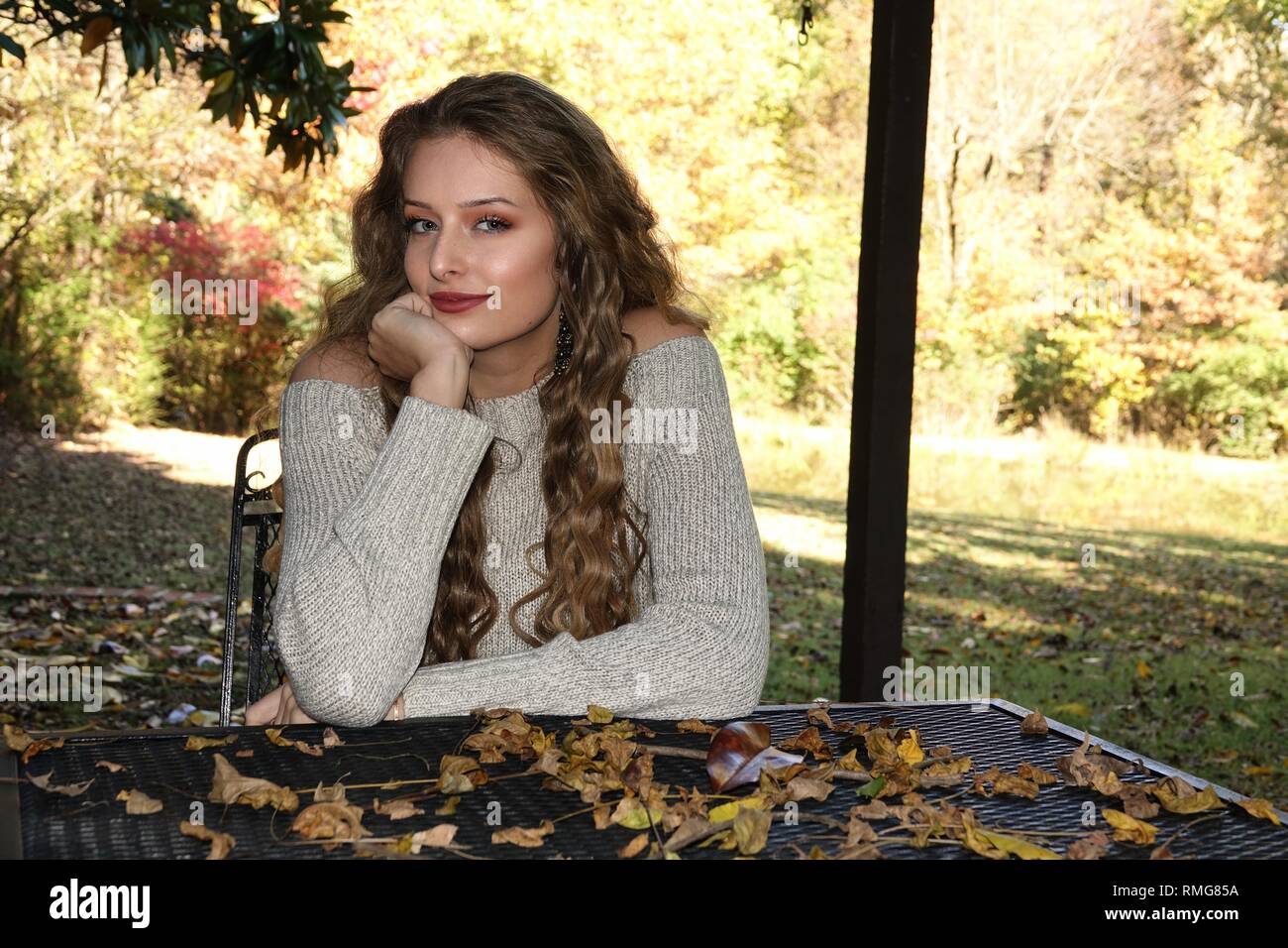 Beautiful country girl in a Fall country setting Stock Photo