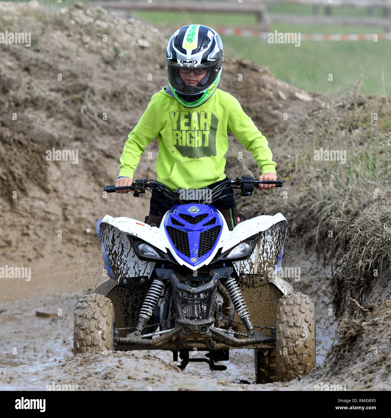 A young boy riding a quad/ATV offroad Stock Photo Alamy