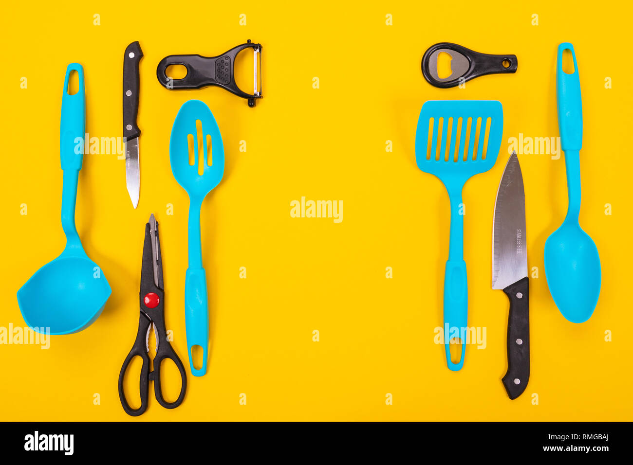 top view of stylish kitchen utensils isolated on yellow background Stock Photo