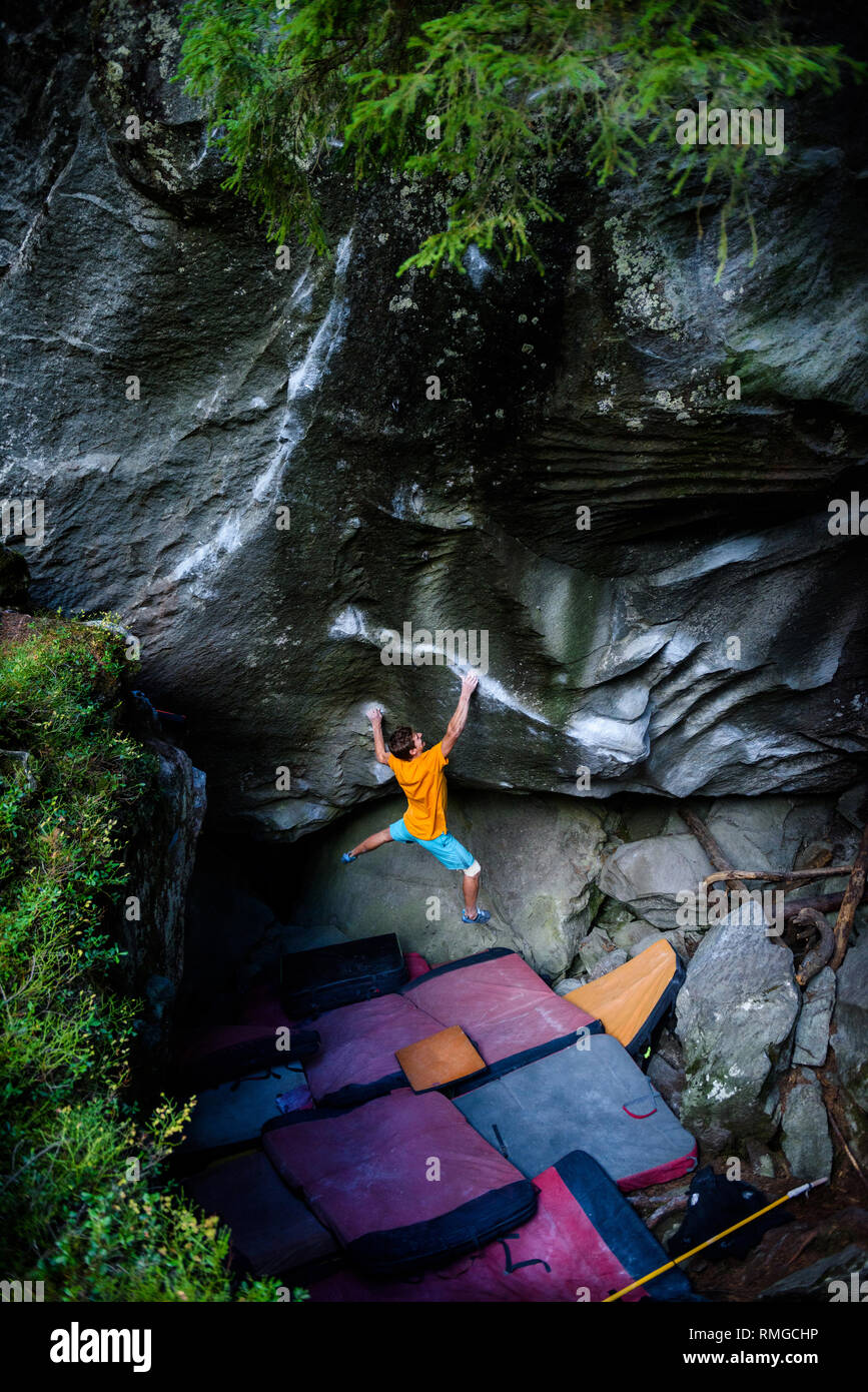 Rock climbing, bouldering. Male athlete on beautiful rocks. Active healthy  sports lifestyle, outdoors. Travel destination Switzerland, Magic Wood  Stock Photo - Alamy