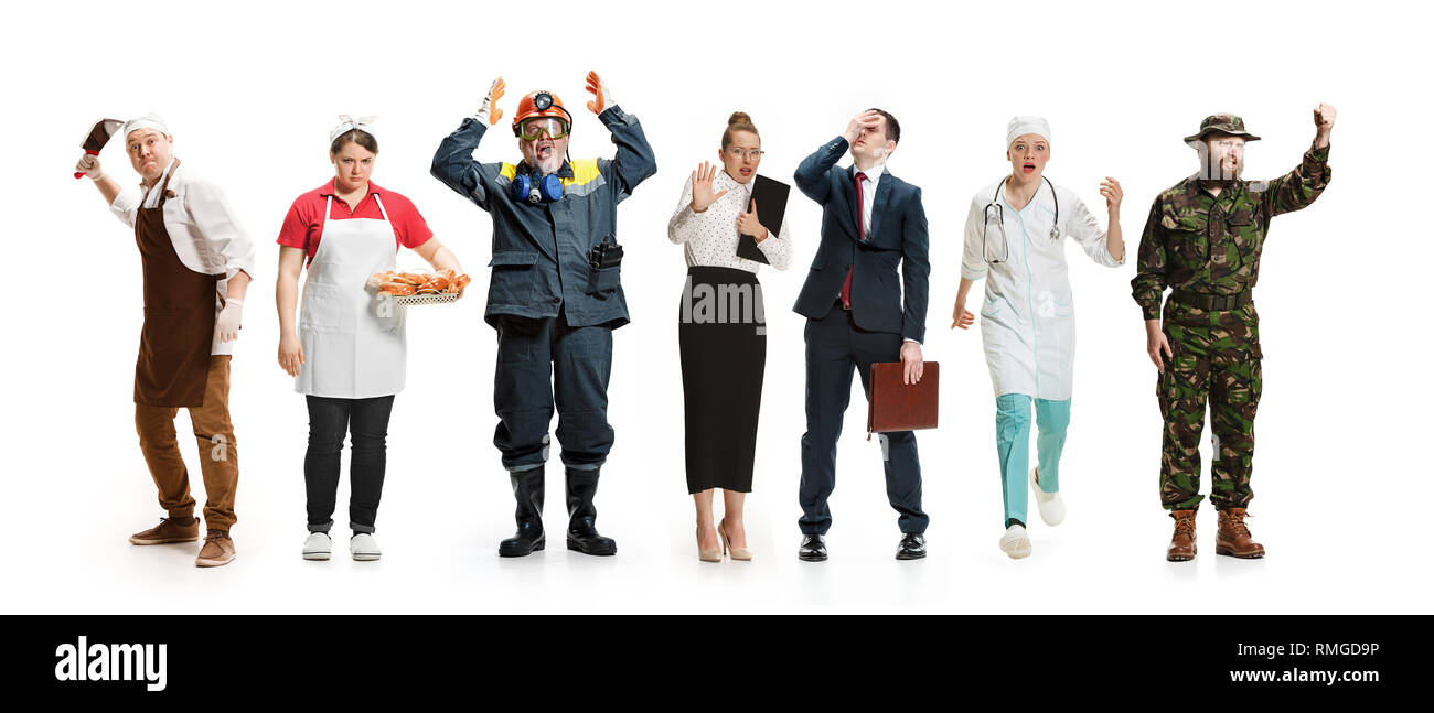 Workers strike concept. Collage of different professions. Group of angry men and women in uniform screaming at studio isolated on white background. Buisiness, professional concepts Stock Photo