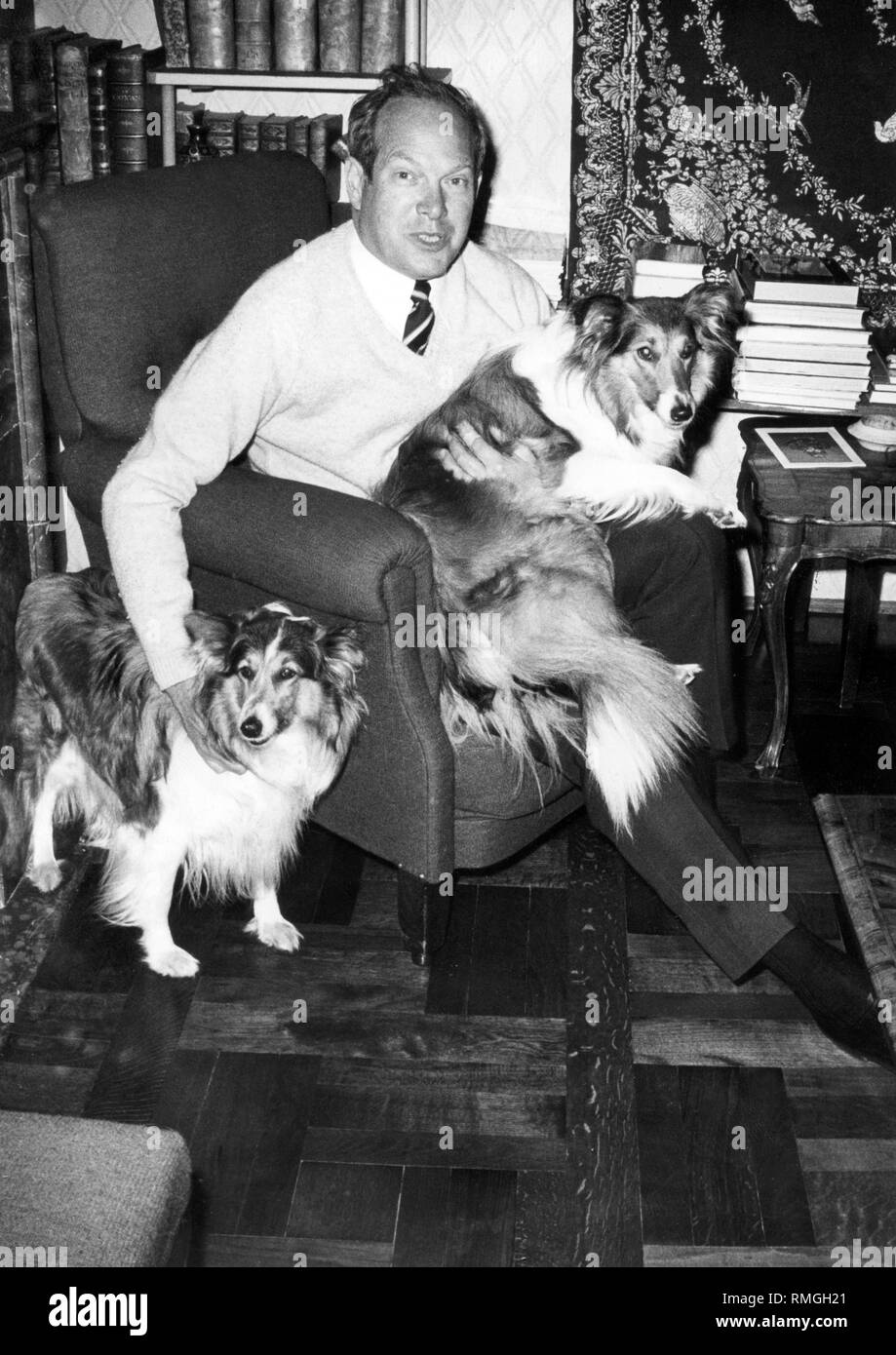 Prince Konstantin of Bavaria in his living room with his dogs. Stock Photo