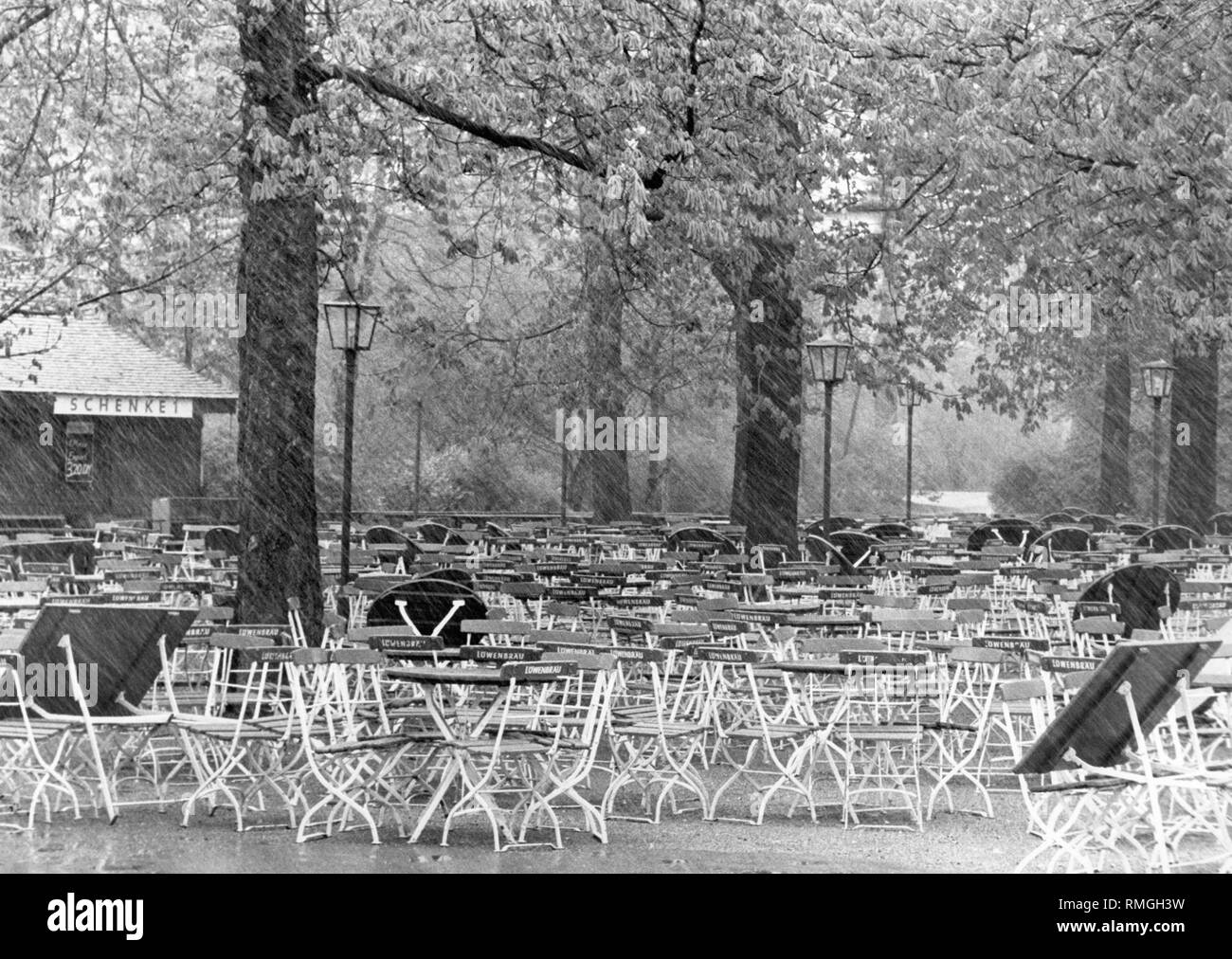The beer garden at the Chinese Tower in the Englischer Garten in Munich was emptied by rain. Stock Photo