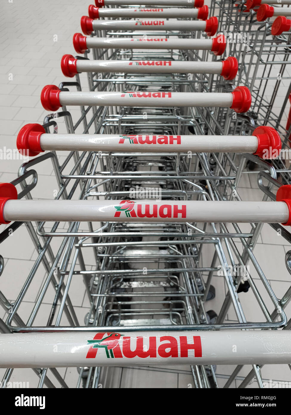 Moscow, Russia - Feb 12. 2019. The cart in grocery in large store network Auchan Stock Photo
