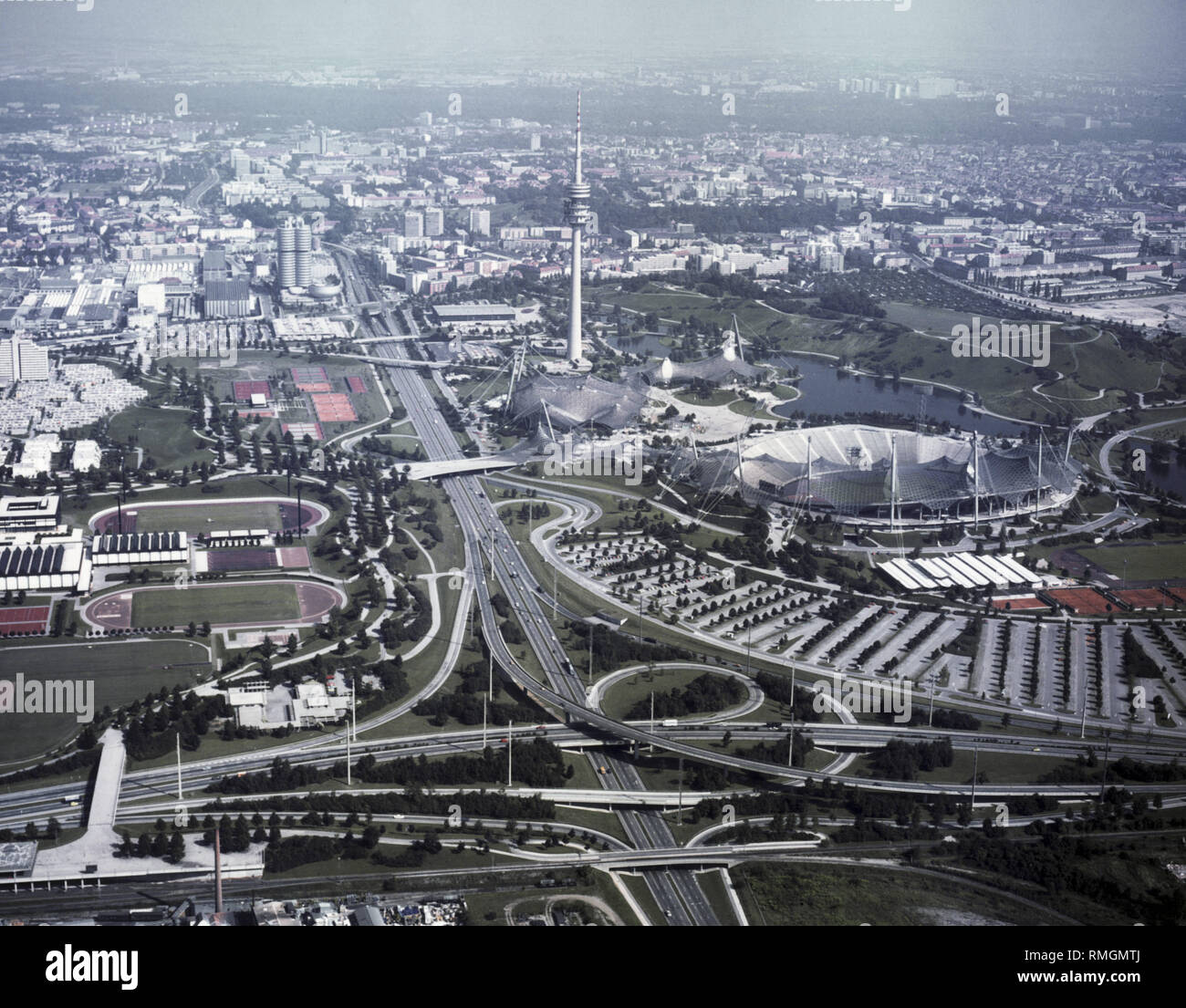 Undated shot of the Munich Olympic Park. In the foreground the intersection Landshuter Allee / Georg-Brauchle-Ring. On the left is the Zentrale Hochschulsportanlage (behind the Olympic Village and the BMW Headquarters.) Right: the Olympic Park with Parkharfe, Werner-von-Linde-Halle, Olympic Stadium, Olympic Hall, Olympic Swimming Pool, Olympic Tower, Olympiasee Lake and Olympiaberg. Stock Photo