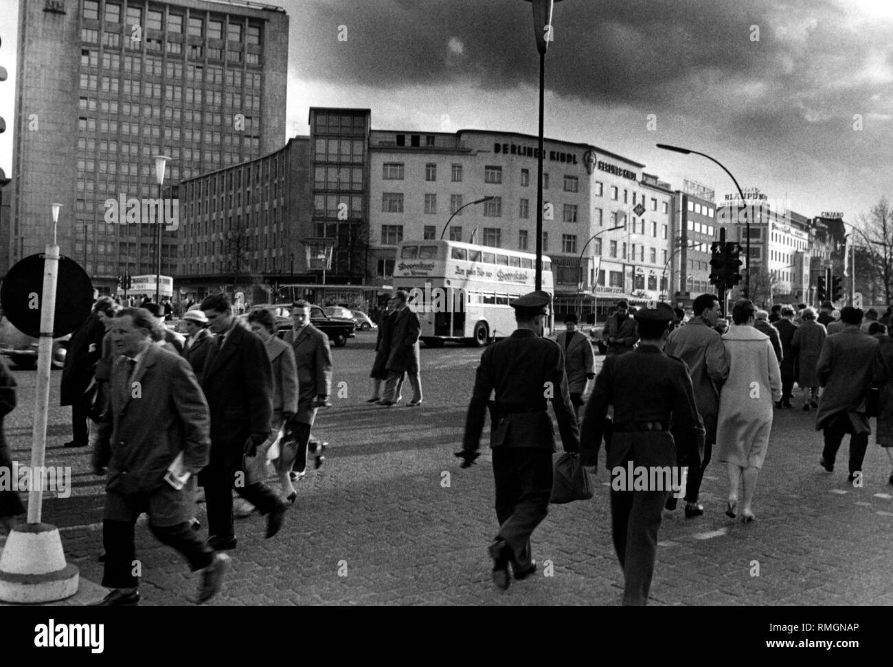 Pedestrians and two policemen at the Kurfürstendamm in West-Berlin (undated picture). Stock Photo