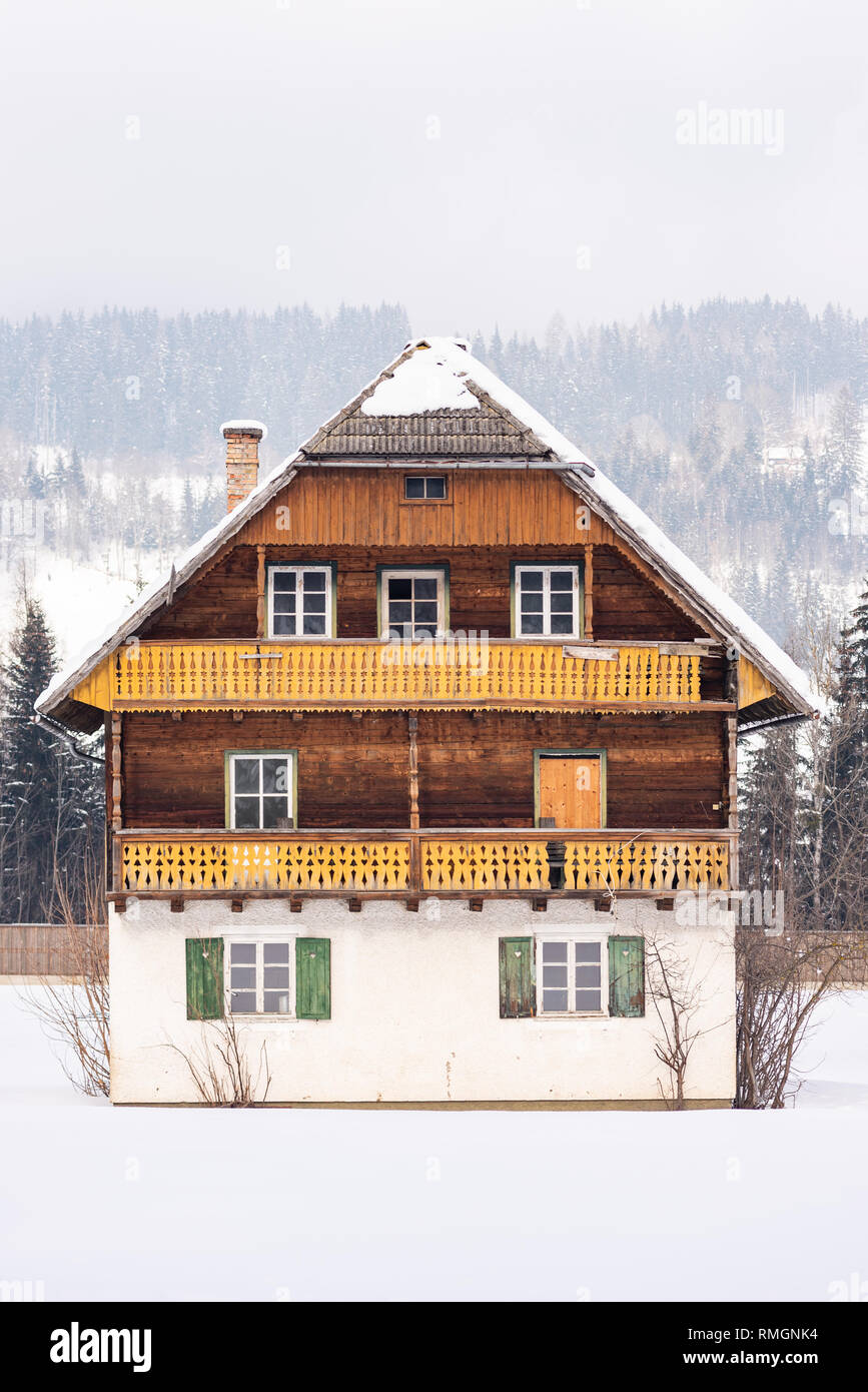 Old mountain wooden house with snowcapped roof ski region Schladming-Dachstein, Dachstein massif, Liezen District, Styria, Austria, Europe Stock Photo