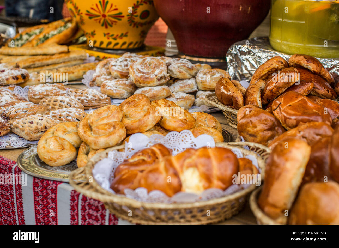 Vibrant food background, street showcase with different traditional Ukrainian rolls and pies. Stock Photo