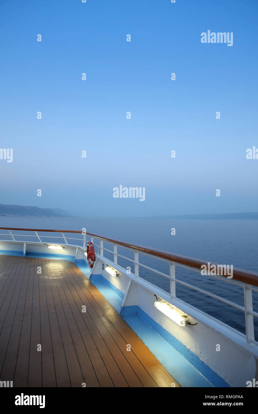 Twlight over a cruise ship deck; a relaxing way to travel, sailing across the calm ocean. Stock Photo