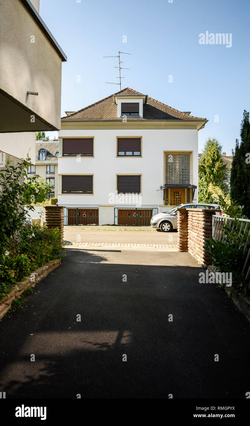 Modern house in french city with nearby parked car tilt shift lens