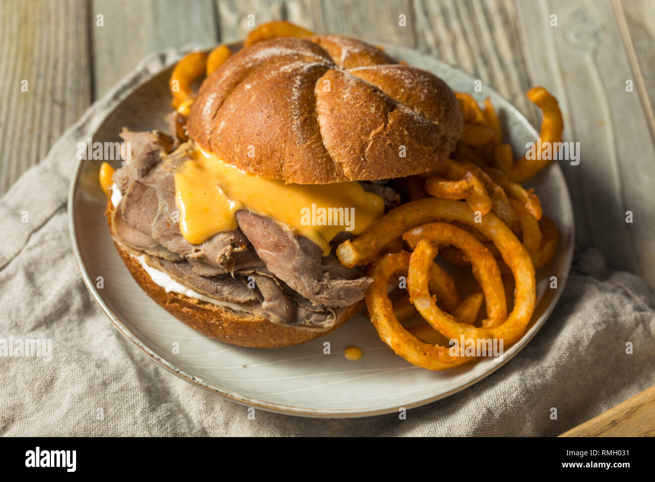 Homemade Roast Beef and Cheddar Sandwich with Curly Fries Stock Photo Alamy