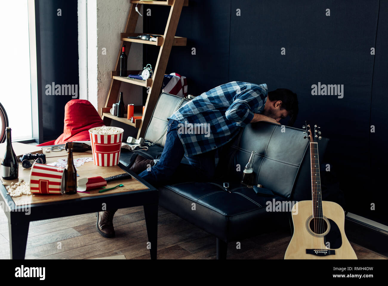 drunk man throwing up after party in messy living room Stock Photo Alamy