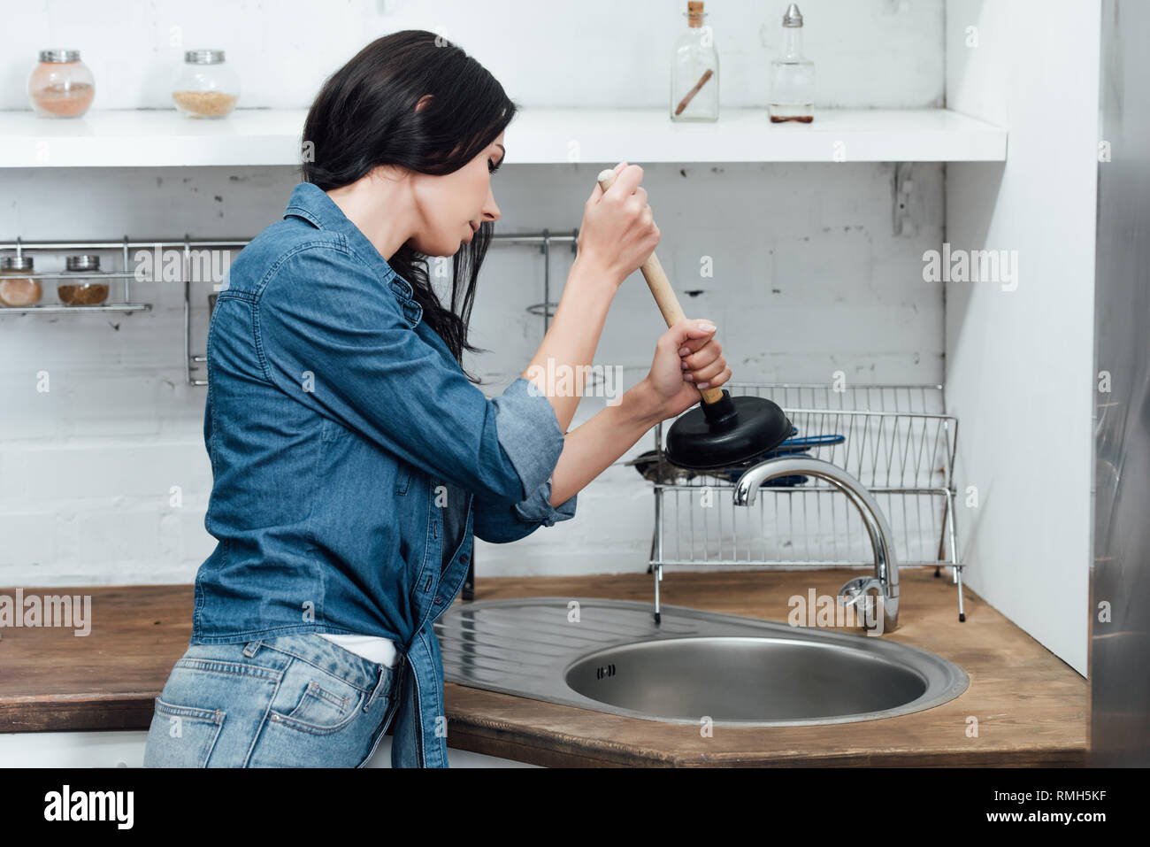 Overflowing Kitchen Sink, Clogged Drain. Hand Holding Plunger. Stock Photo  - Image of homemaker, home: 208234932