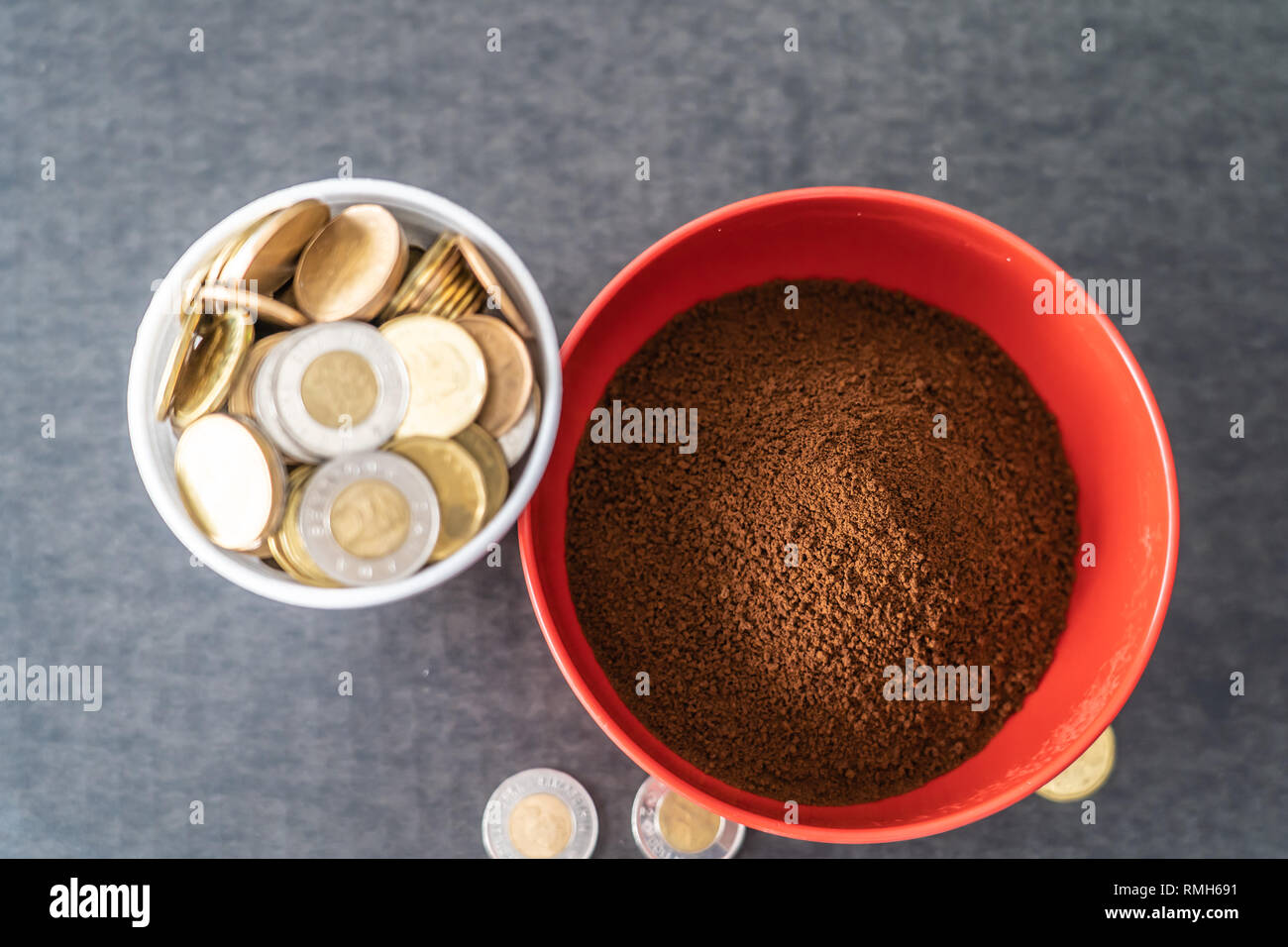 https://c8.alamy.com/comp/RMH691/styrofoam-cup-full-of-coins-with-red-bowl-of-instant-coffee-RMH691.jpg