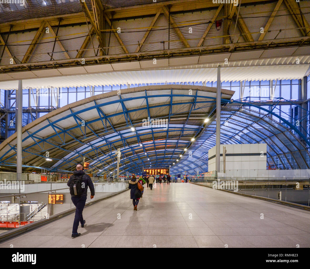 London, Feb 13, 2019: Inside view of passengers at Waterloo Station, one of London's largest rail stations with impressive architecture Stock Photo