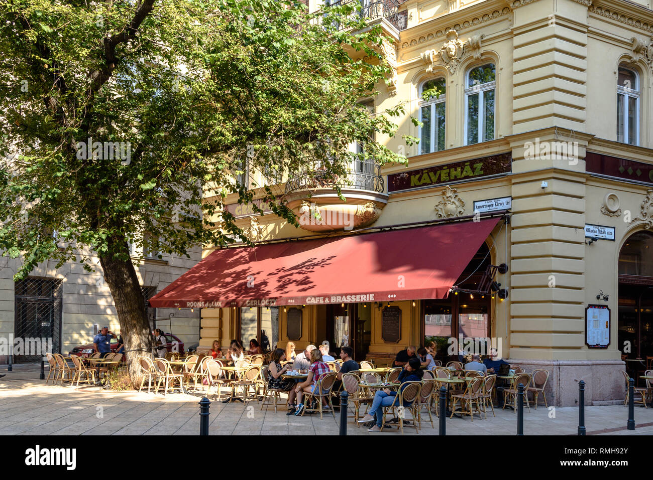 People enjoying breakfast on a cafe terrace in central Budapest, Hungary Stock Photo