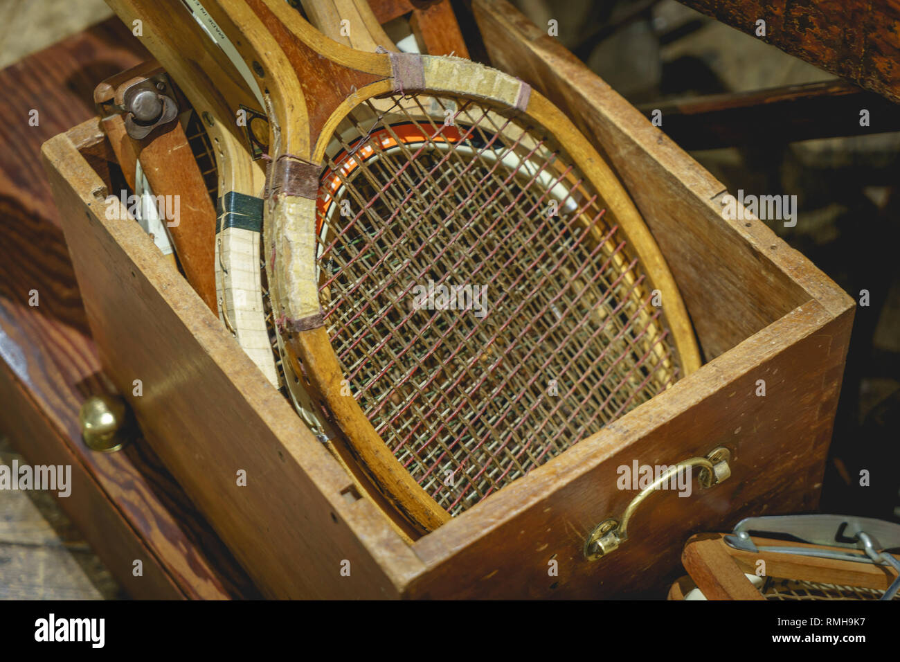 Details of vintage wooden tennis rackets in a box. Landscape format. Stock Photo