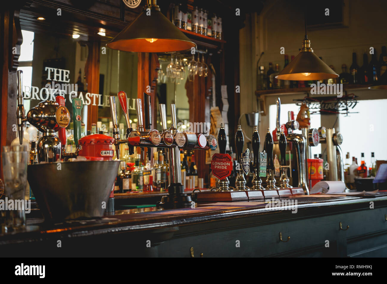 London, UK - February, 2019. Draught beer taps in a traditional pub in central London. Stock Photo
