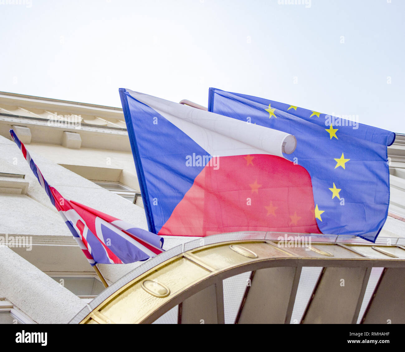 The English, Czech and European flags blowing in the wind Stock Photo