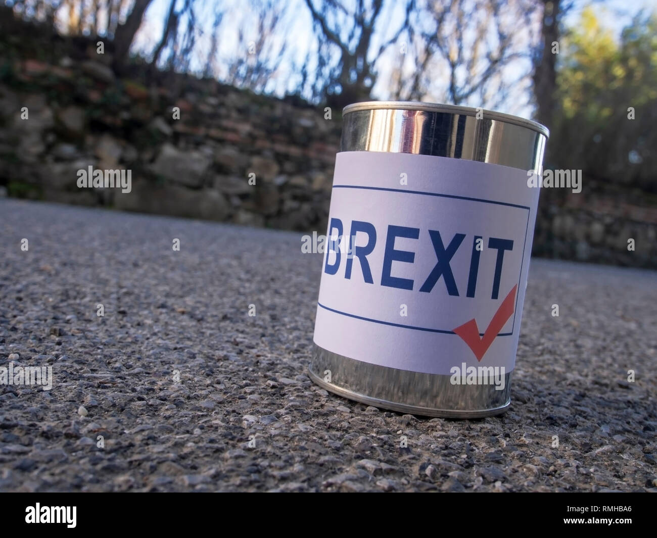 Brexit tin can in the road ready for a kick, UK EU politics metaphor or concept. Stock Photo