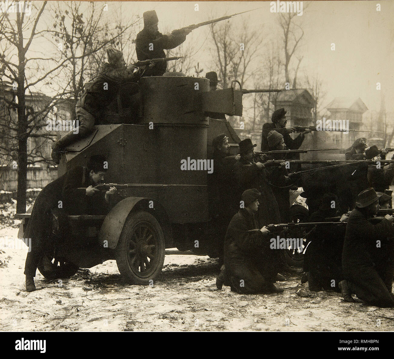 October Revolution. Red Guard Soldiers near Captured Armoured Car. 25 October, 1917. Petrograd. Photograph Stock Photo