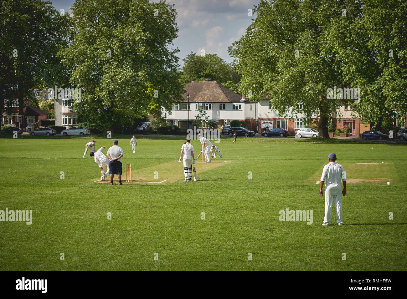 London, UK - February, 2019. People playing cricket in park in South London Stock Photo