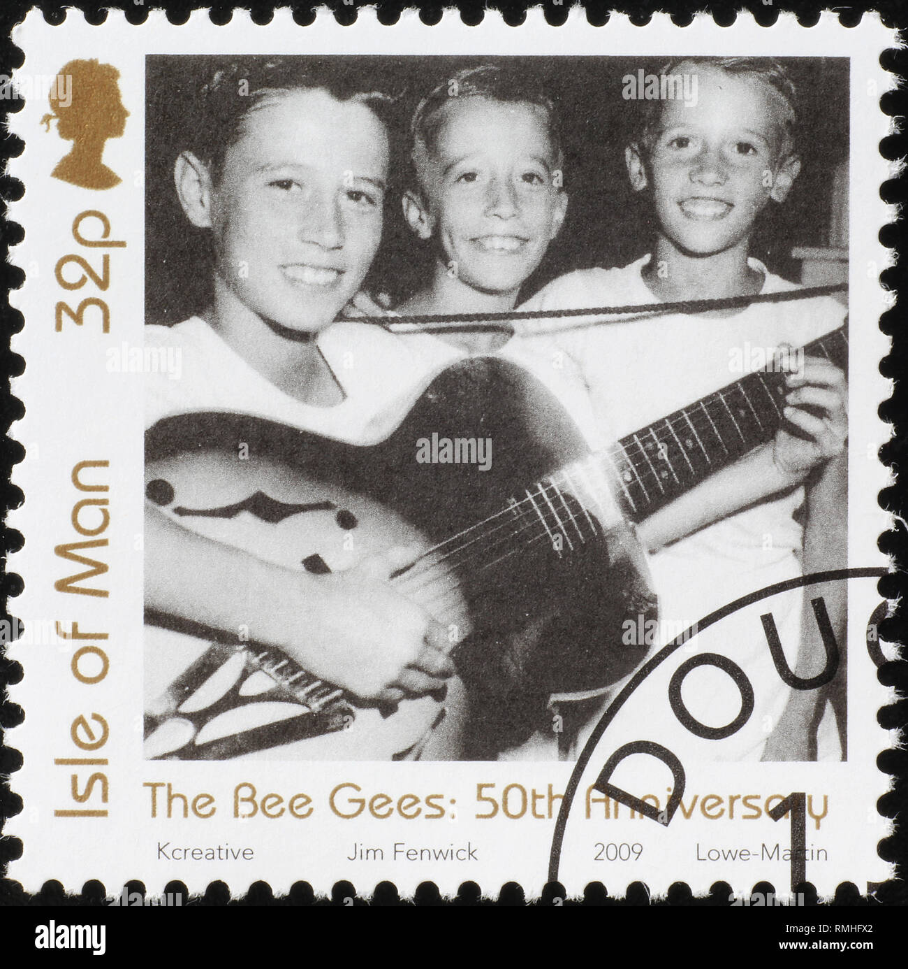 Picture of young Bee Gees on postage stamp Stock Photo