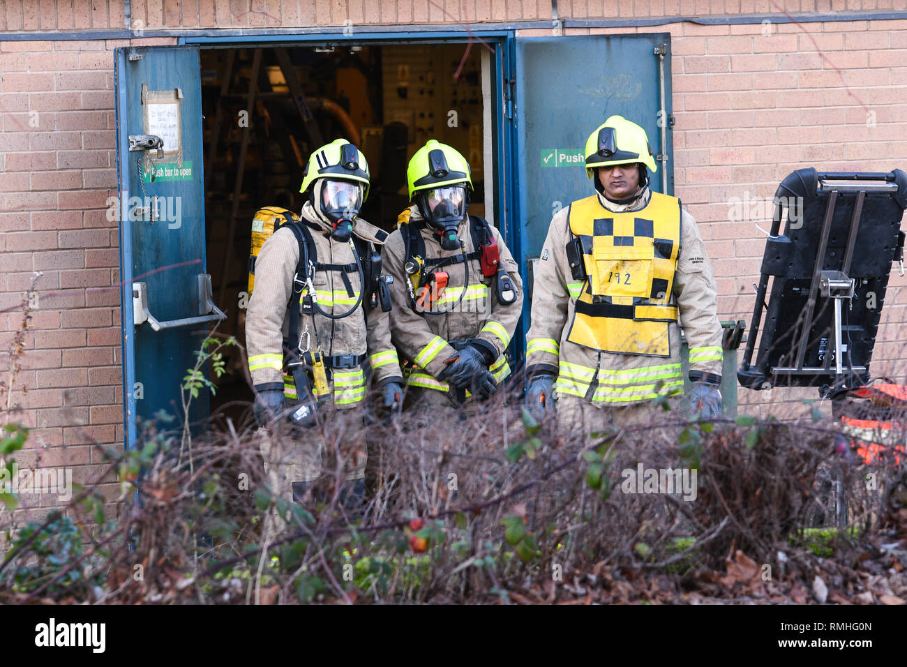 firefighters wearing breathing apparatus Stock Photo