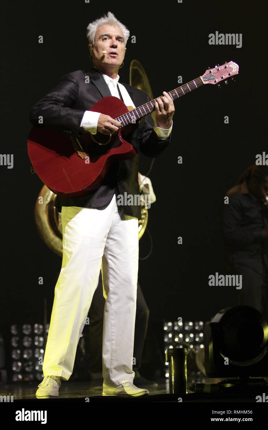 Musician David Byrne is shown performing on stage during a 'live' concert appearance with St.Vincent. Stock Photo