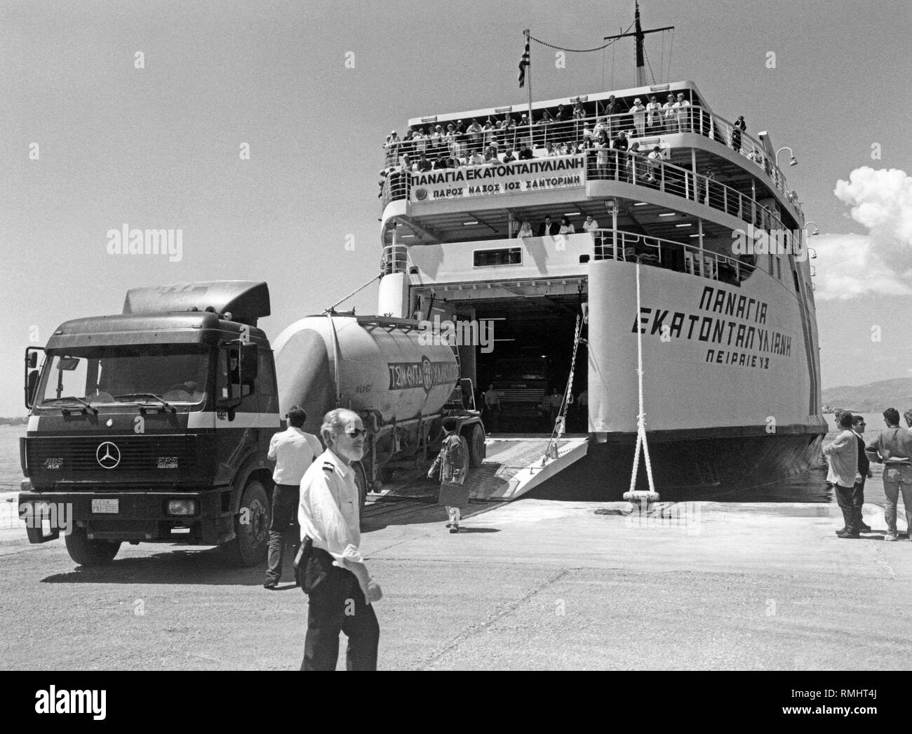 A truck leaves a RoRo ferry in the harbor of the Greek island of Naxos Stock Photo