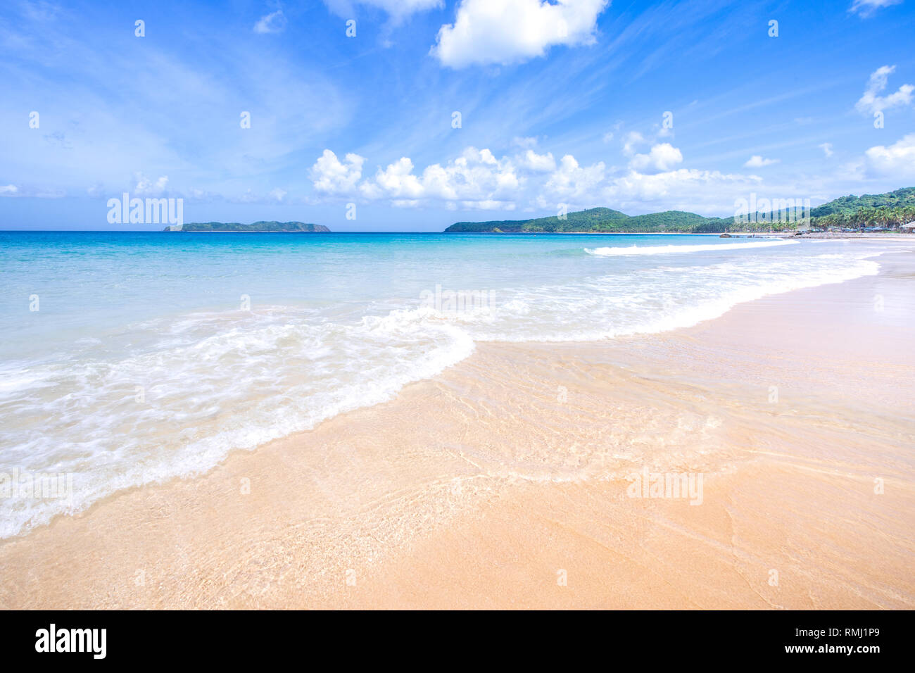 Beautiful amazing gold colored sandy beach with soft waves isolated ...