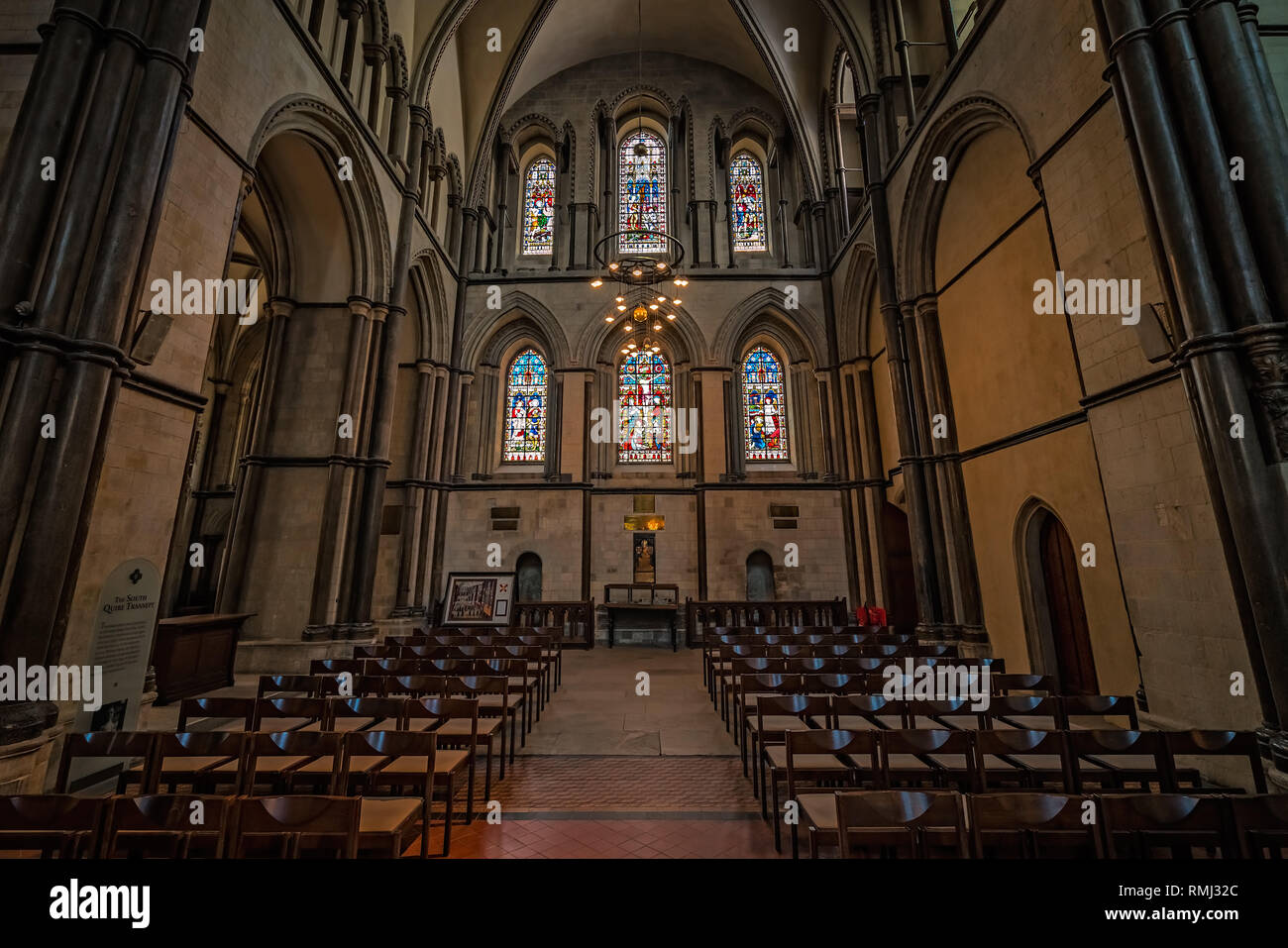 Rochester, England July 2018 Stained glass windows and seats inside