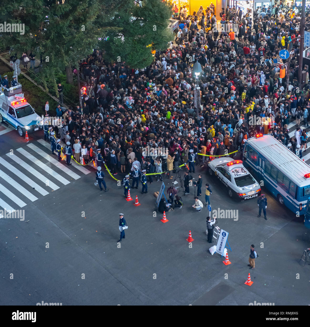 Pedestrians crosswalk at Shibuya district in Tokyo, Japan. Shibuya Crossing is one of the busiest crosswalks in the world. Stock Photo