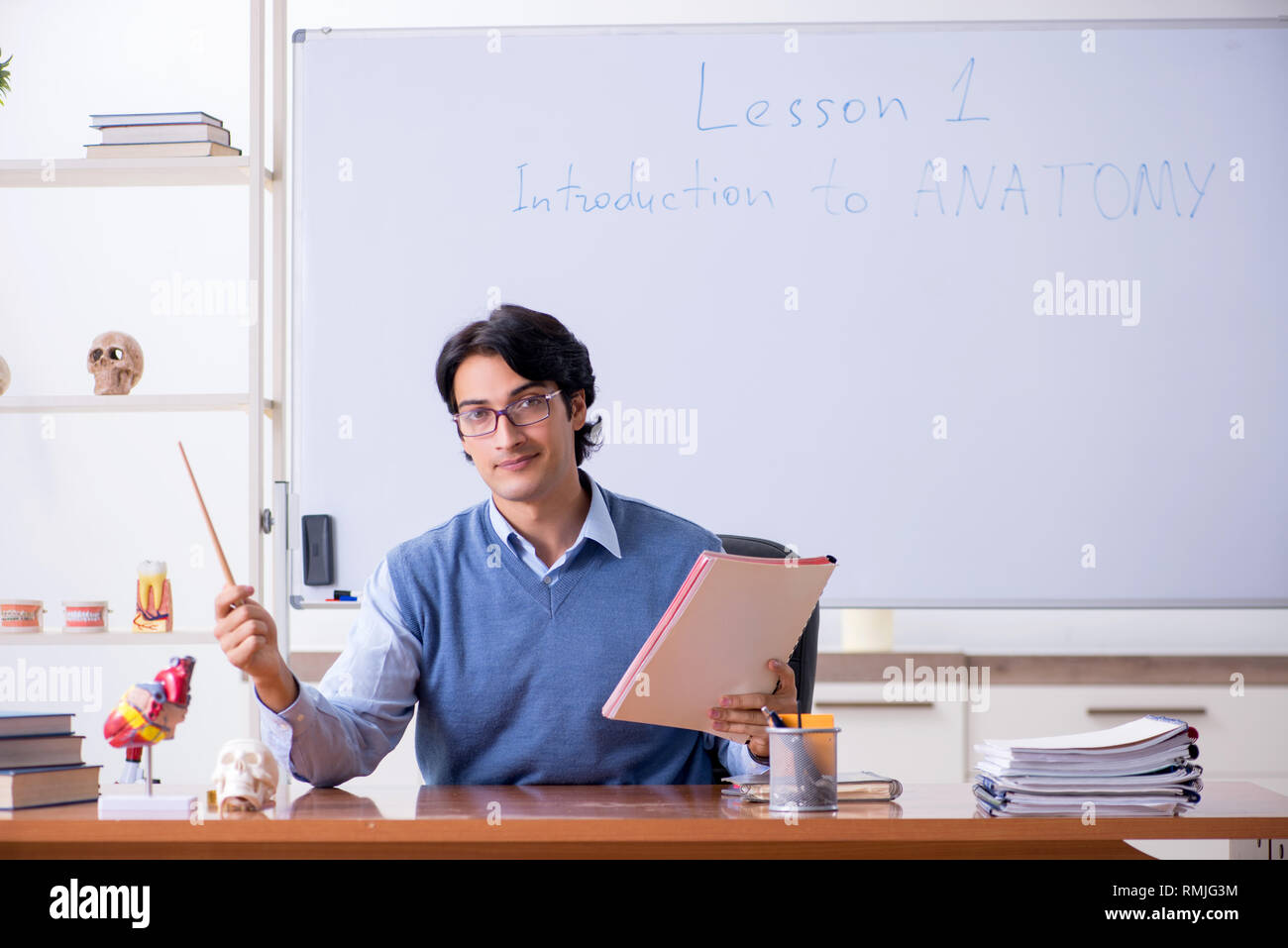 Young lecturer teacher teaching anatomy Stock Photo