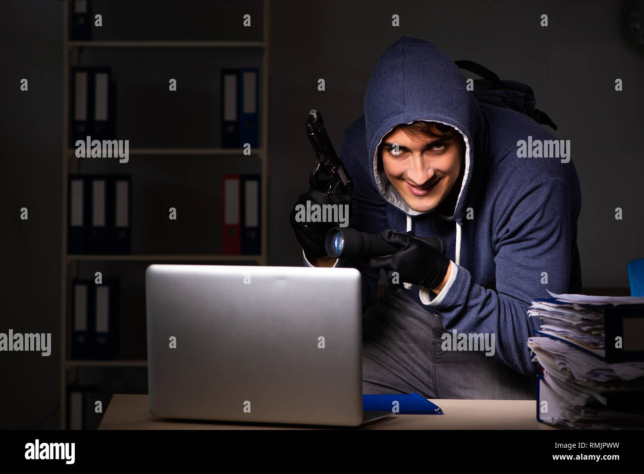 Thief trying to steal personal data in identity theft concept Stock Photo