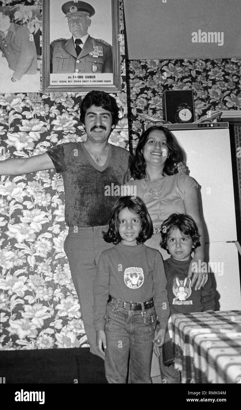 The Turkish-born family Yesiltepe in their Munich apartment with a portrait of the Turkish President Kenan Evren. Stock Photo