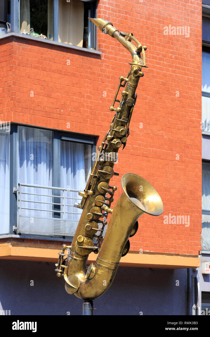 Close-up of a giant saxophone in the city of Dinant, Belgium where this musical instrument was invented by Adolphe Saxe in the 1840s Stock Photo